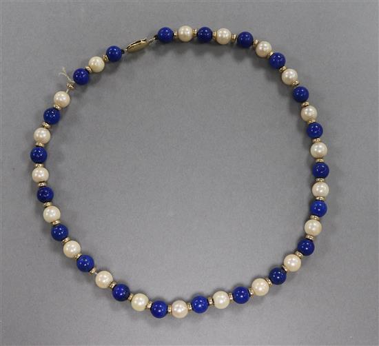 A cultured pearl, lapis lazuli bead necklace with 14ct gold clasp, 39cm.